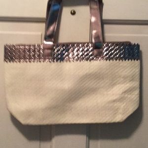 White and metallic bag.